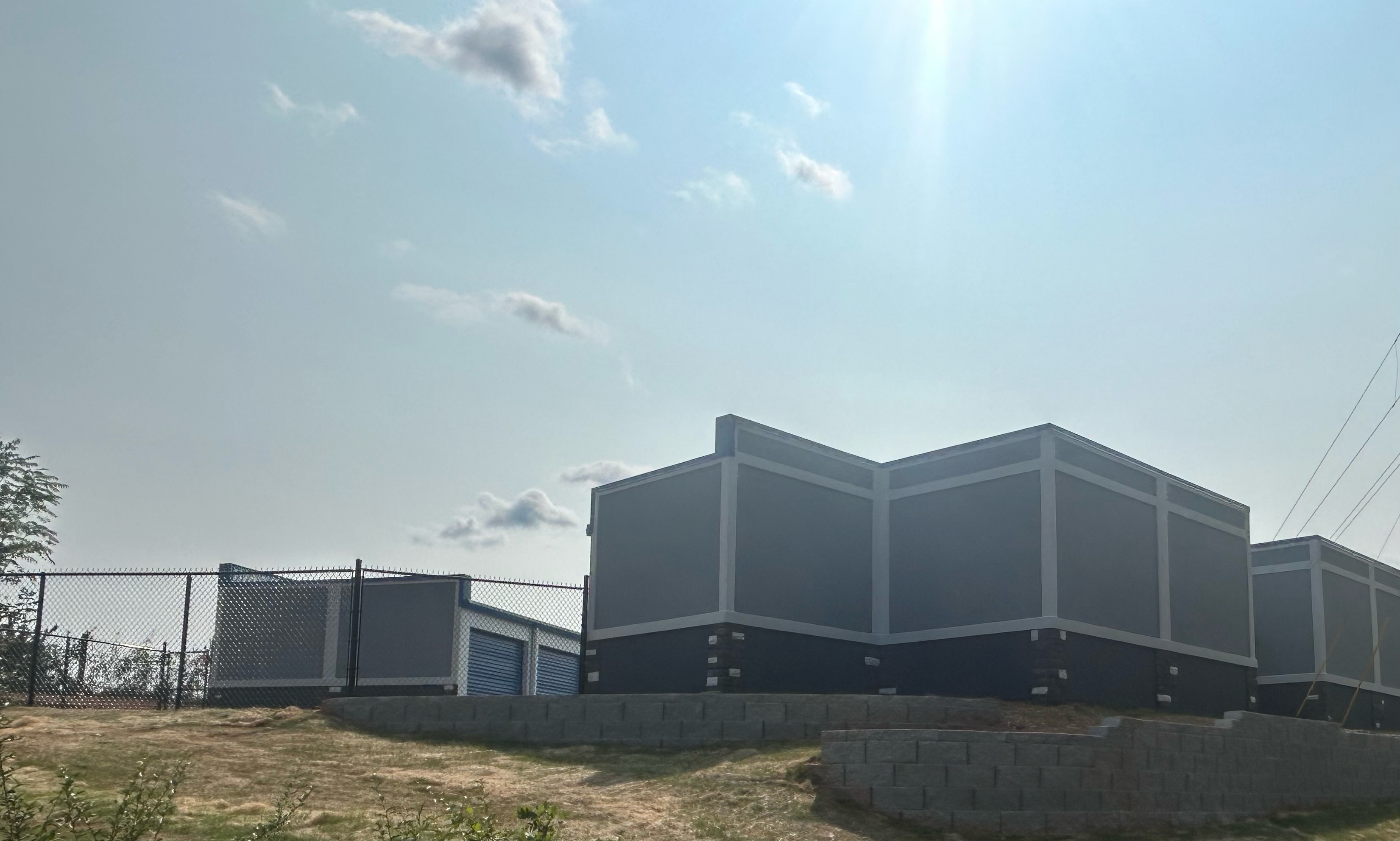 Modern gray and white storage buildings at Storage Solutions of Lenoir