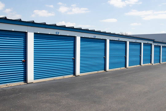 Exterior view of blue drive-up storage unit doors